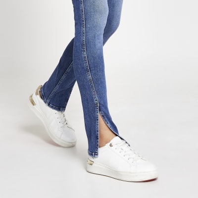 split hem blue jeans