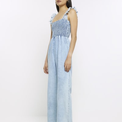 Blue denim shirred jumpsuit River Island