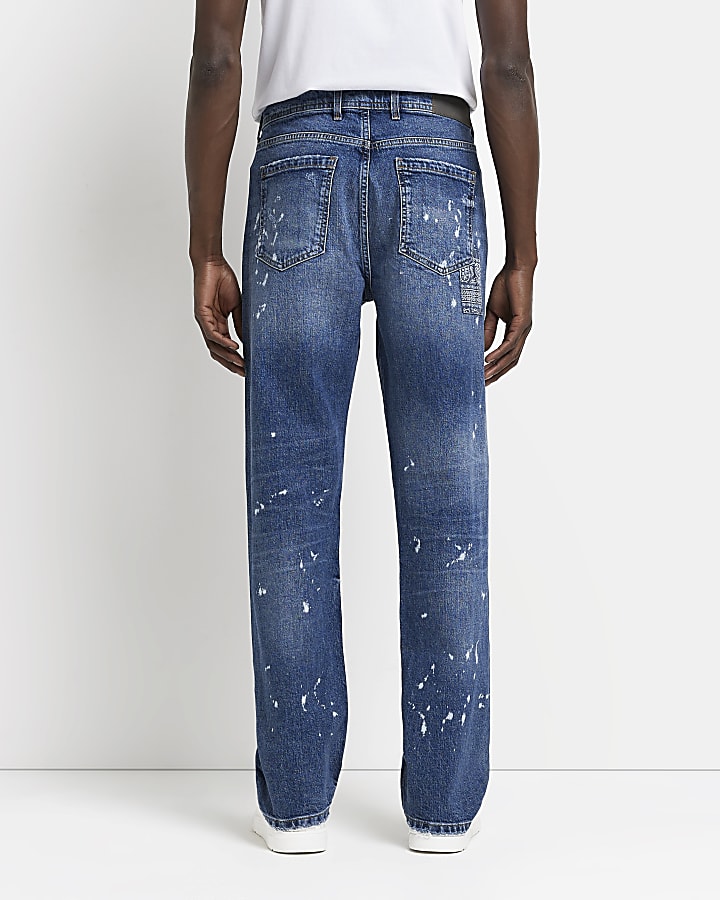Blue loose fit paint splatter ripped jeans