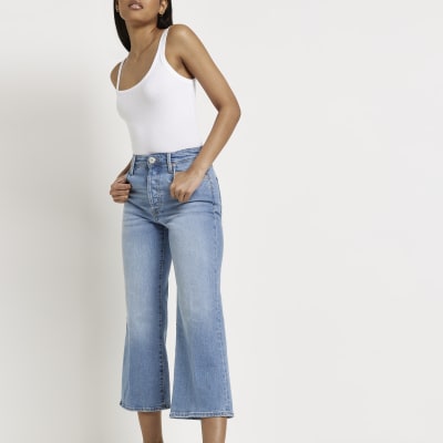 Blue mid rise cropped flared jeans | River Island
