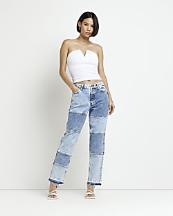 Blue mid rise patched straight leg jeans