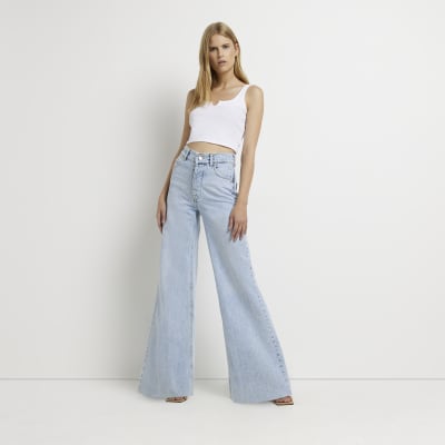 Blue mid rise ultra flared jeans | River Island