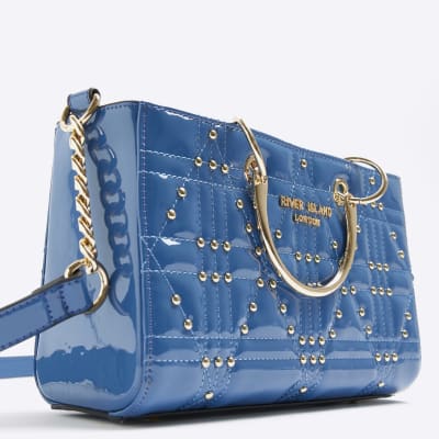 Blue patent studded tote bag River Island