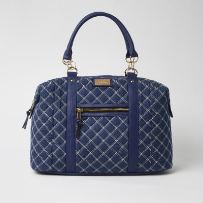 Blue quilted denim weekend bag River Island