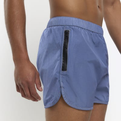Blue regular fit iridescent swim shorts River Island