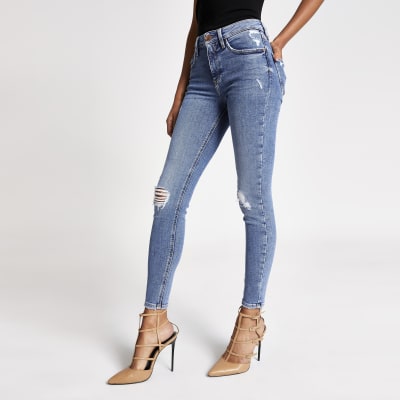 Blue ripped Amelie super skinny jeans | River Island