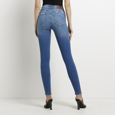 Blue ripped bum sculpt skinny jeans | River Island