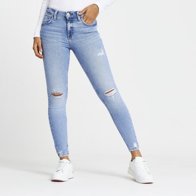 Blue ripped mid rise skinny jeans | River Island