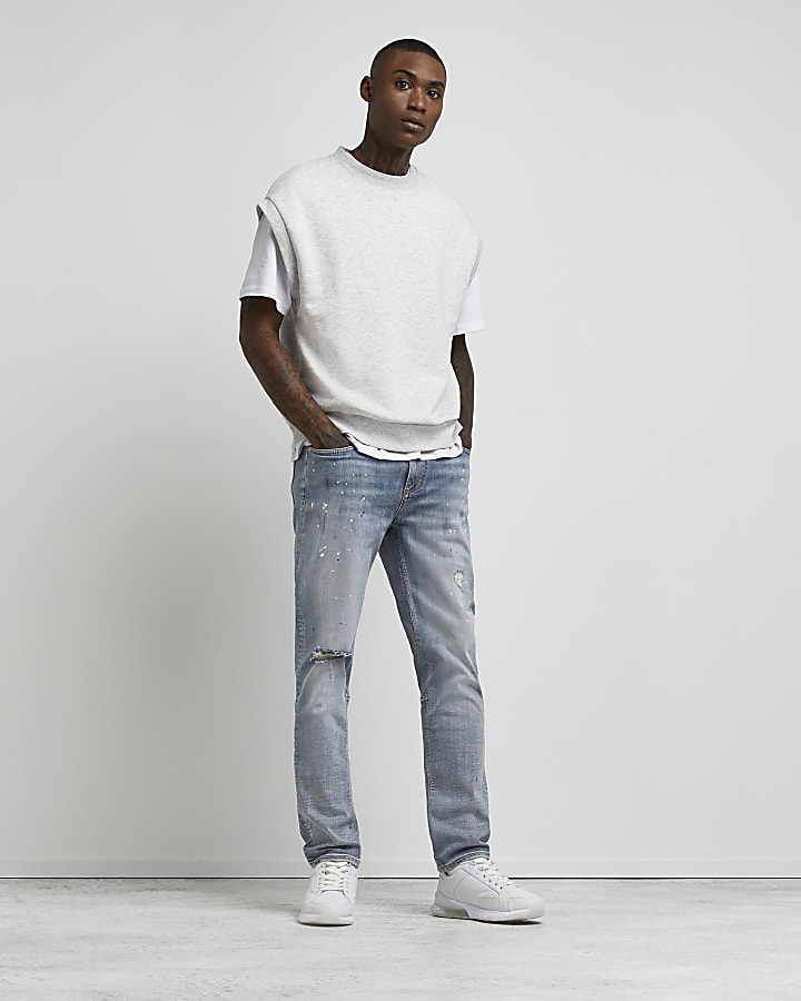 Blue ripped paint relaxed skinny fit jeans