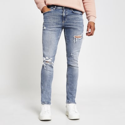 Blue ripped skinny fit jeans | River Island