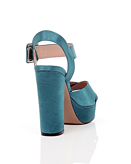 360 degree animation of product Blue satin cross strappy platform heels frame-14