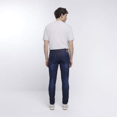 Blue skinny fit faded stacked jeans | River Island