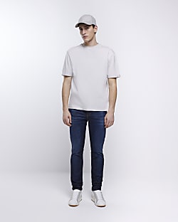 Blue skinny fit faded stacked jeans