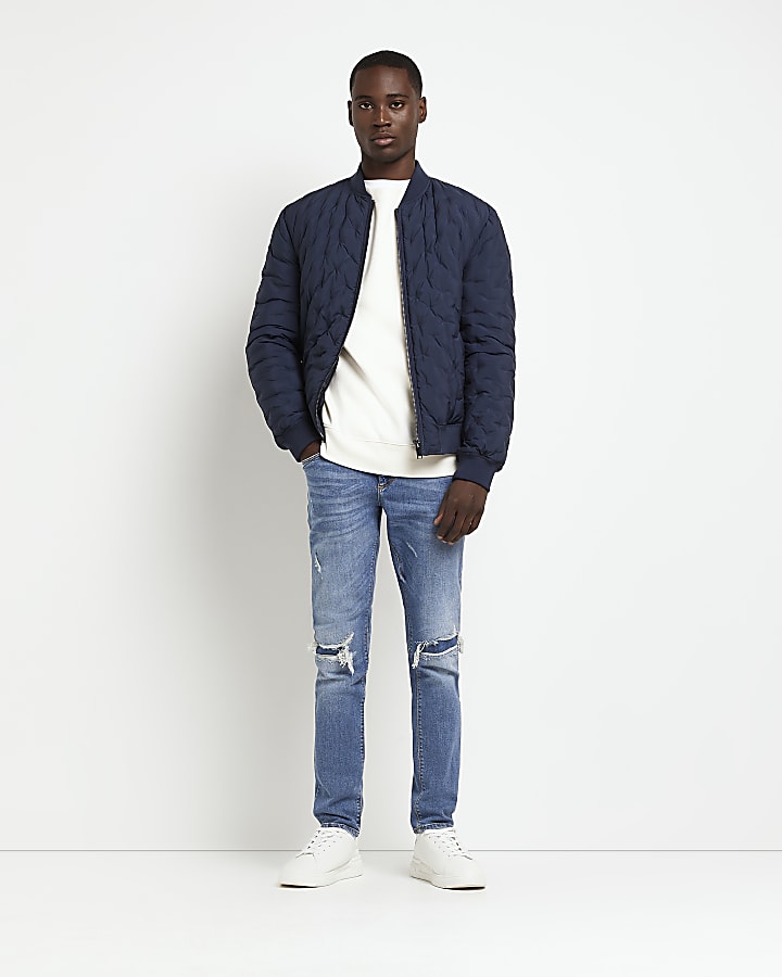 Blue Skinny fit ripped jeans | River Island