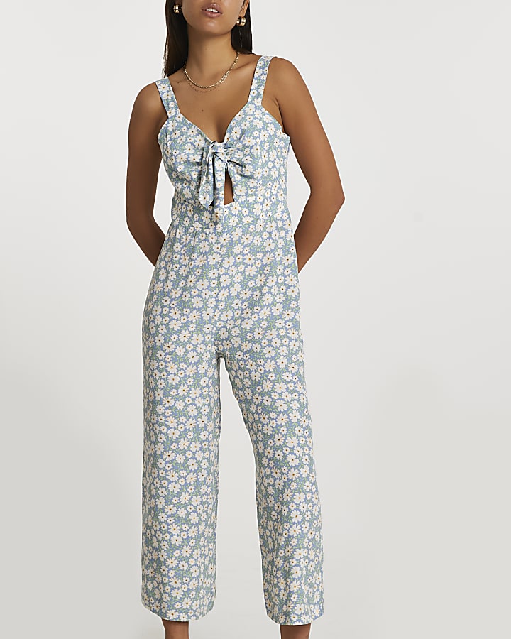Blue sleeveless floral front tie jumpsuit