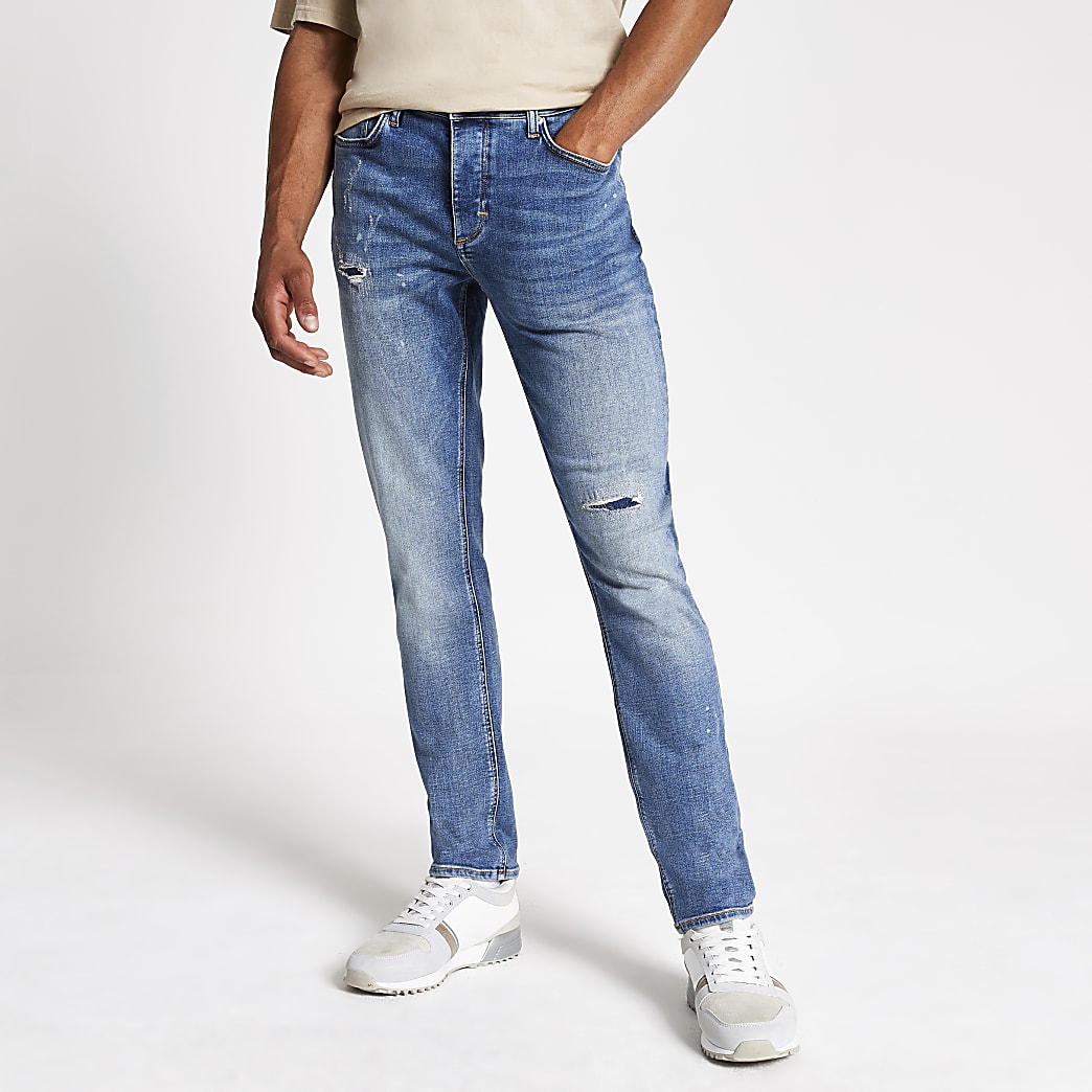 Blue slim fit Dylan ripped jeans | River Island