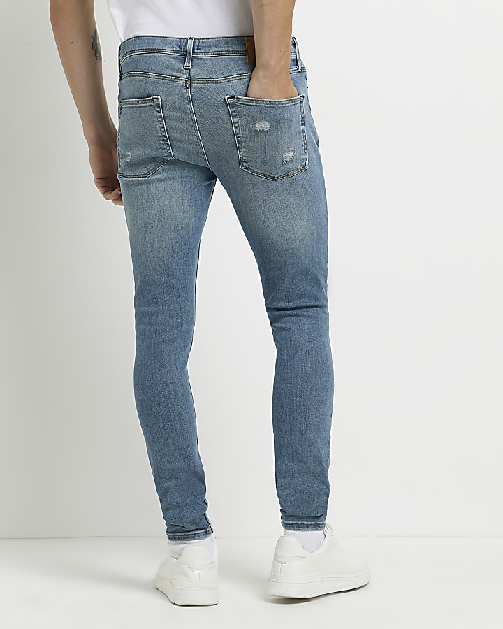 Blue spray on ripped super skinny fit jeans