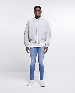 Blue spray on super skinny fit faded jeans