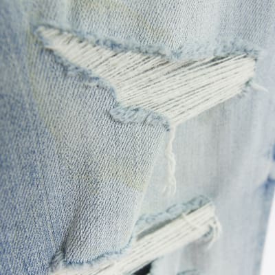 Blue spray on super skinny fit ripped jeans