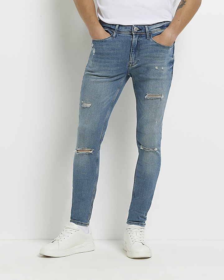 Blue super skinny spray on ripped jeans