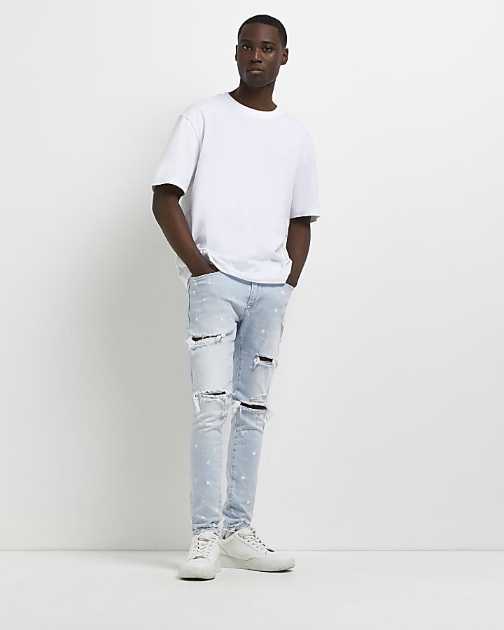 Blue super skinny spray on ripped jeans