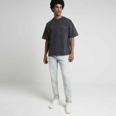 Blue tapered fit jeans | River Island