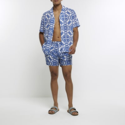 Blue tie dye swim shorts River Island