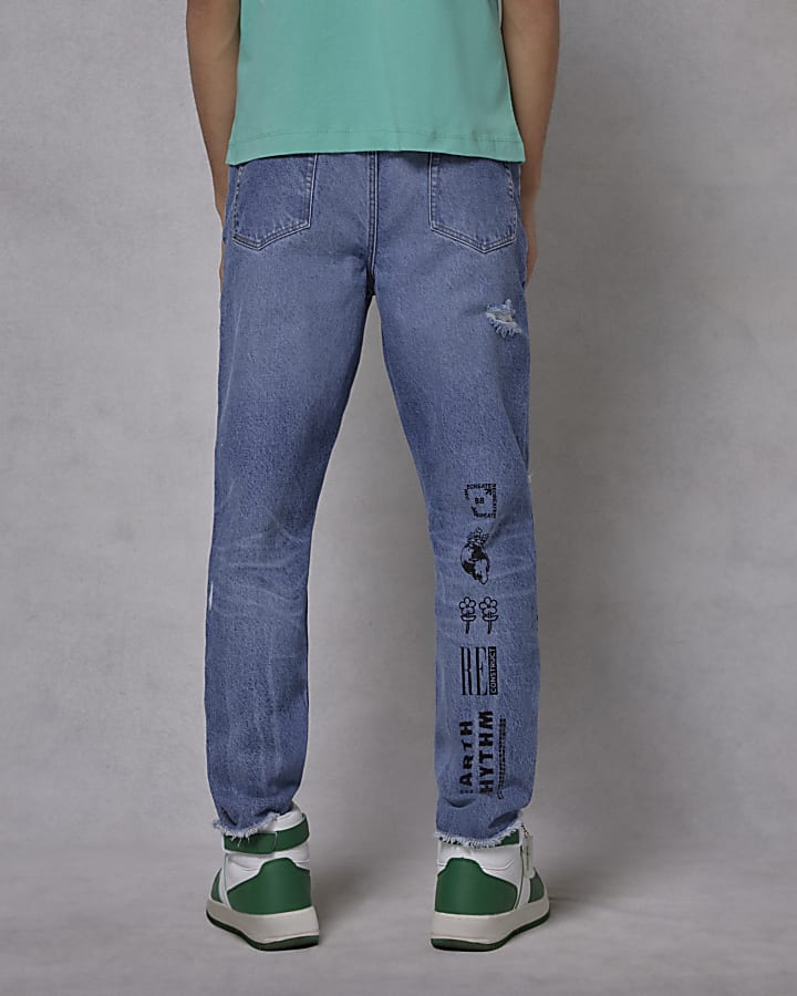 Boys blue graphic rip slim jeans