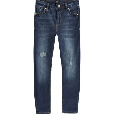 Boys blue Ollie spray on skinny ripped jeans | River Island