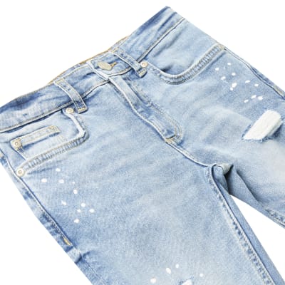 Boys blue ripped paint splat skinny jeans River Island