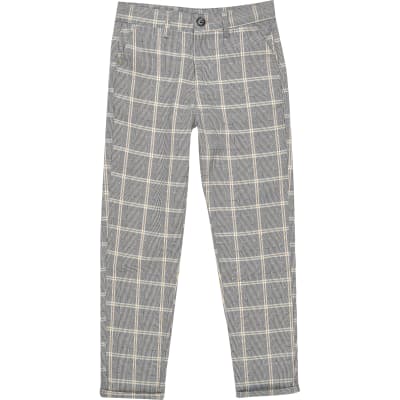 boys pull on trousers