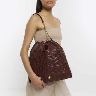 Brown embossed drawstring shoulder bag