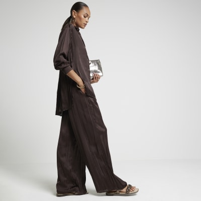 Brown satin crinkle trousers River Island