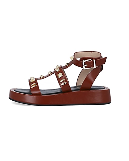 360 degree animation of product Brown studded gladiator sandals frame-3