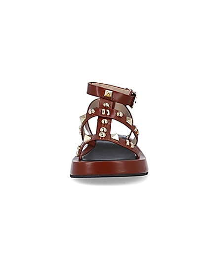 360 degree animation of product Brown studded gladiator sandals frame-21