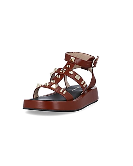 360 degree animation of product Brown studded gladiator sandals frame-23
