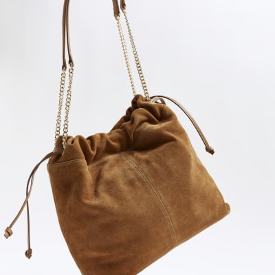 Brown suede drawstring shoulder bag River Island