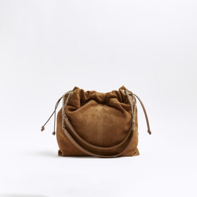 Brown suede drawstring shoulder bag River Island