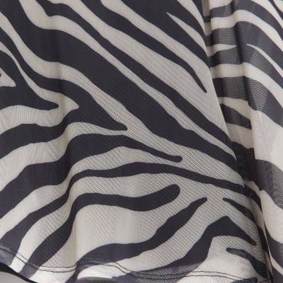 Cream animal print long sleeve blouse