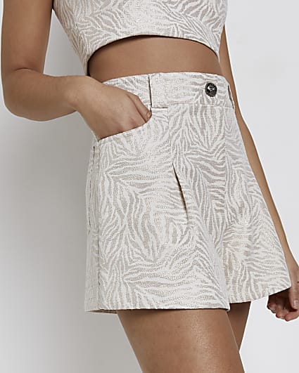 Cream animal print pleated shorts