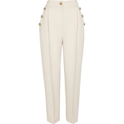 Cream button front peg trousers