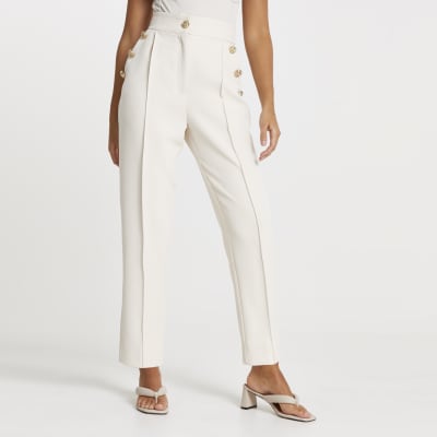 Cream button front peg trousers
