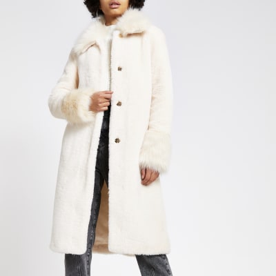 Cream faux fur longline coat | River Island