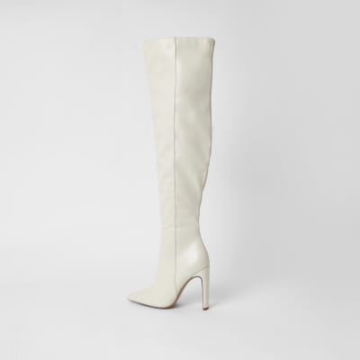 Cream faux leather pull on high leg boots