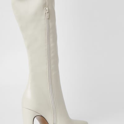 Cream faux leather pull on high leg boots