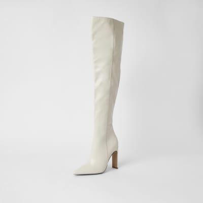 Cream faux leather pull on high leg boots