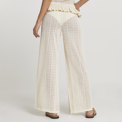 Cream frill hem knitted trousers