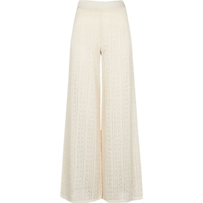 Cream frill hem knitted trousers