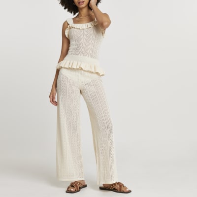 Cream frill hem knitted trousers