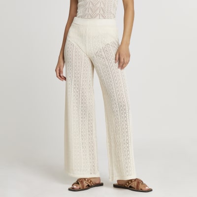 Cream frill hem knitted trousers